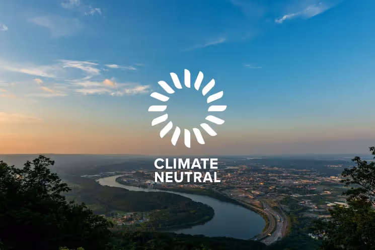 Panoramic aerial of Chattanooga with the Climate Neutral logo.