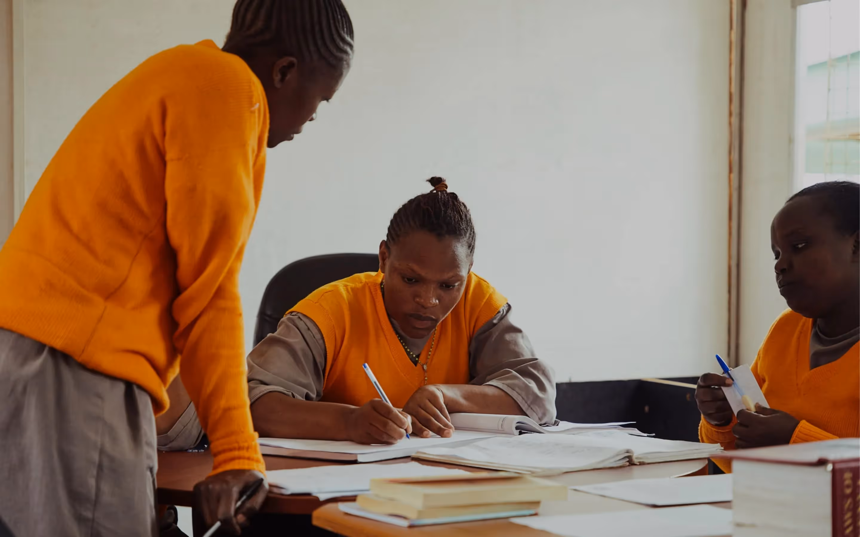 Justice Defenders participants study in a library.