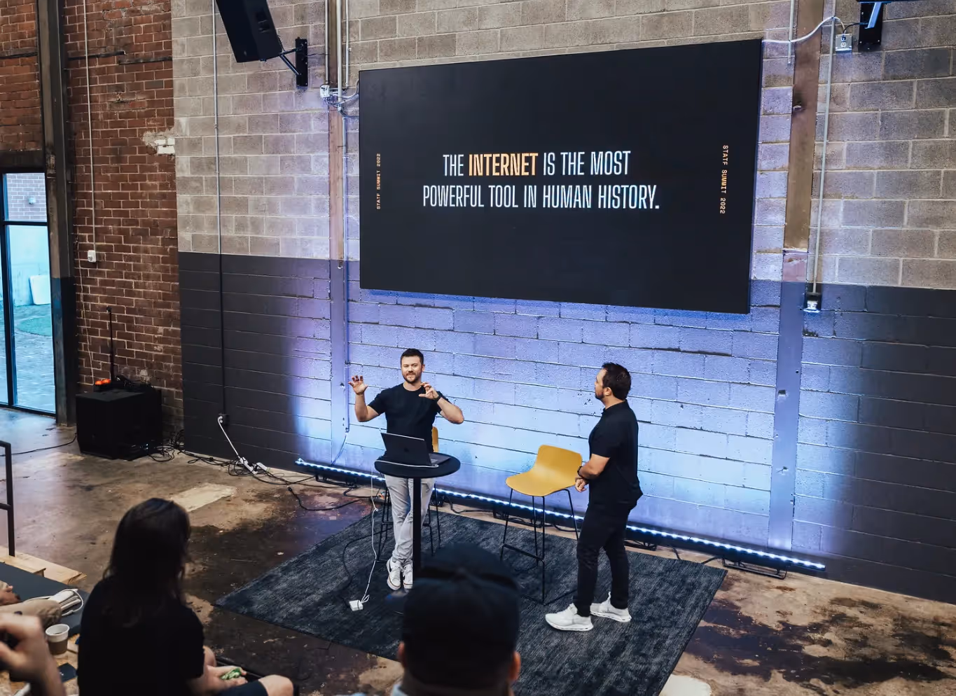 Taylor and Eric speaking on stage