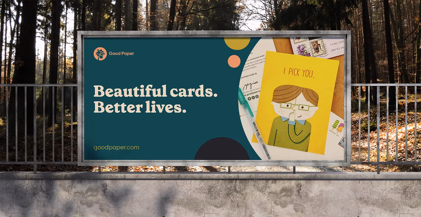 A hand holds a deck of greeting cards from Good Paper.