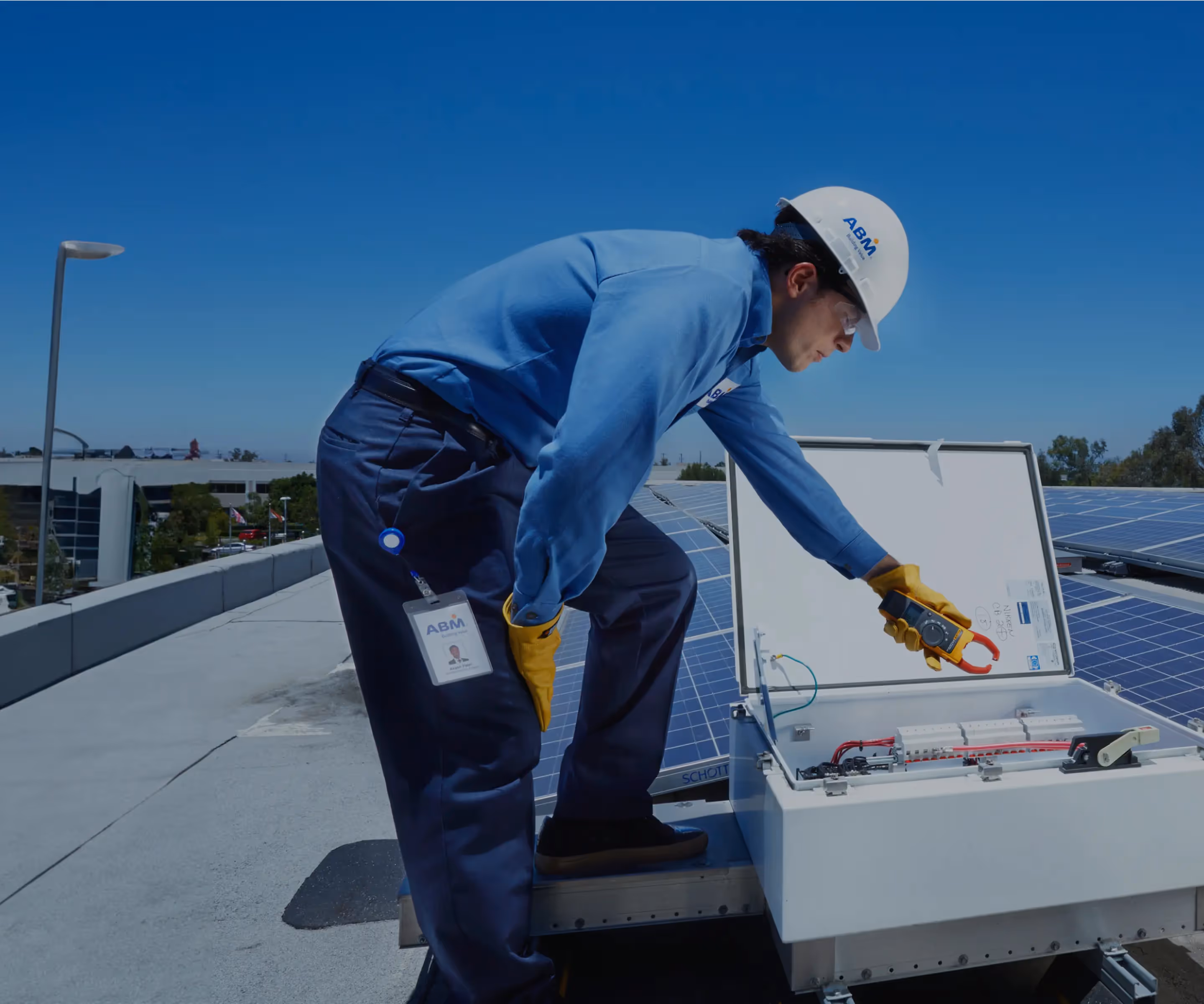 AMB worker doing work on the top of a building.
