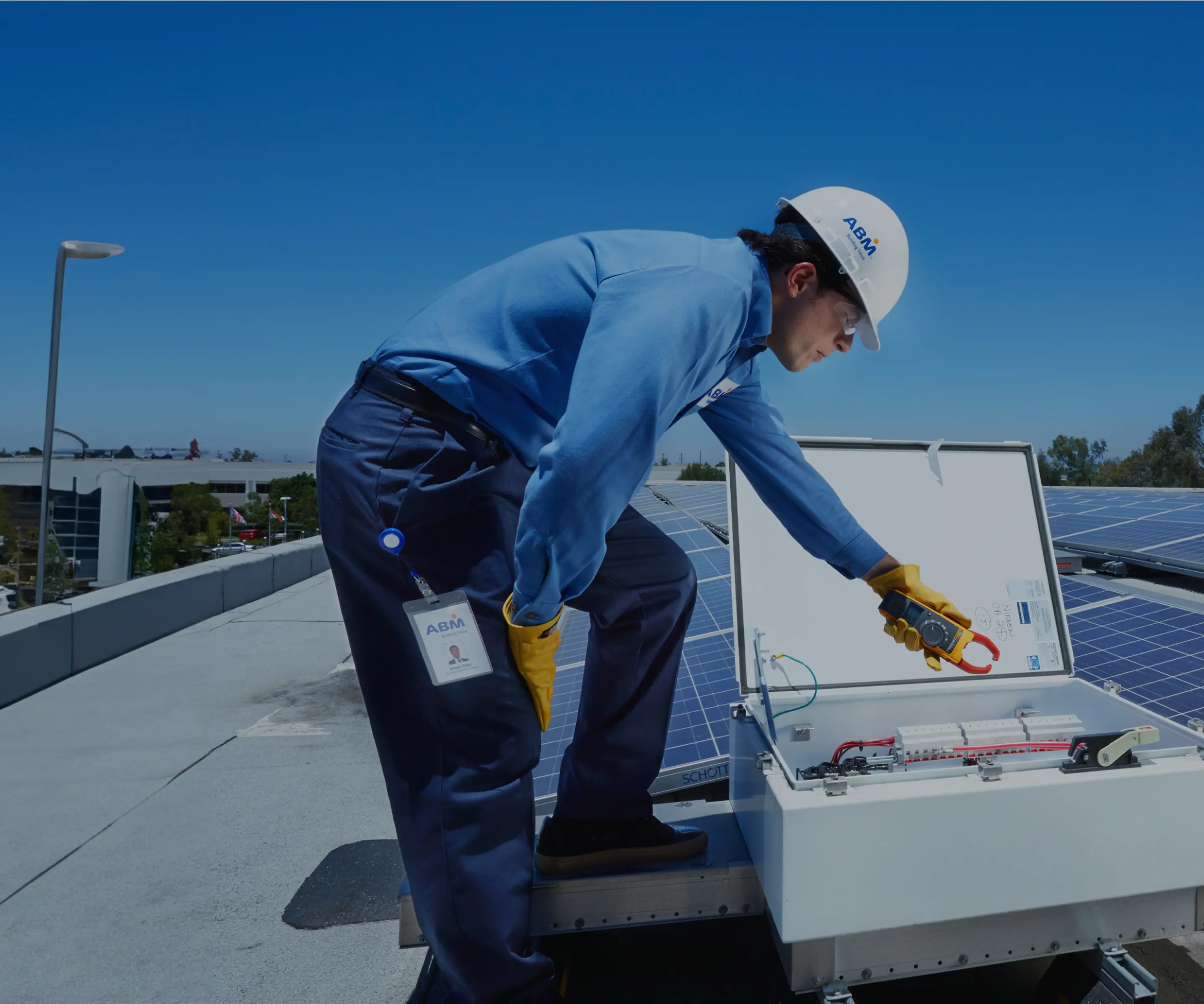 AMB worker doing work on the top of a building.