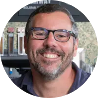 Mike Monen, acclaimed restaurateur, celebrating Whiteboard's visionary brand development and creative artistry