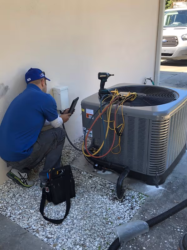 Ryan Service Technician working on Air Conditioning Repairs.
