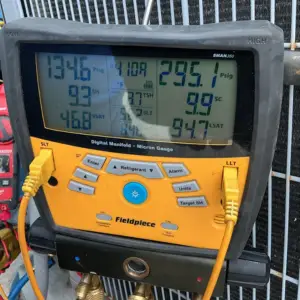 air conditioning maintenance meter hooed up to air conditioner