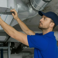 Abbott Air Inc. HVAC service technician at work
Experienced HVAC technician repairing air conditioning unit
Abbott Air team of professional HVAC technicians
