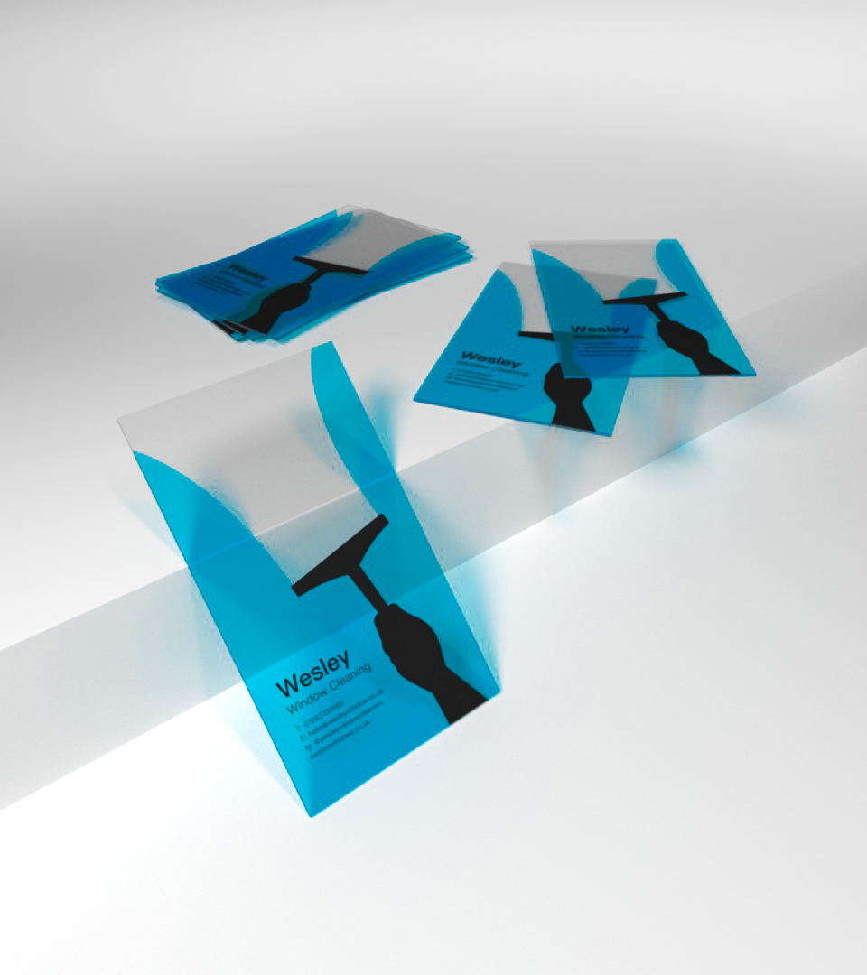 A messy bakery table with two business cards.