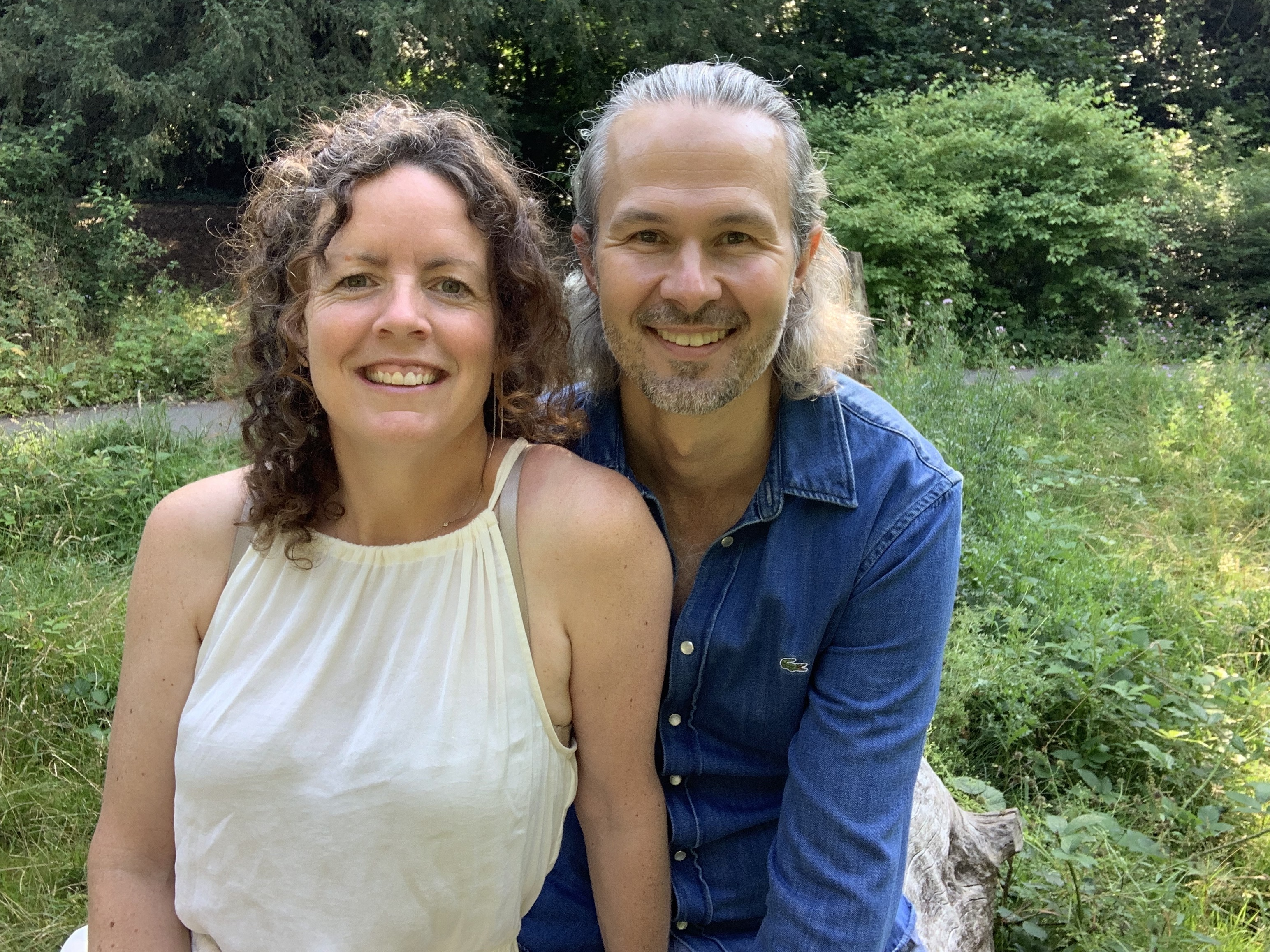 Picture of a man and women smiling into the camera 