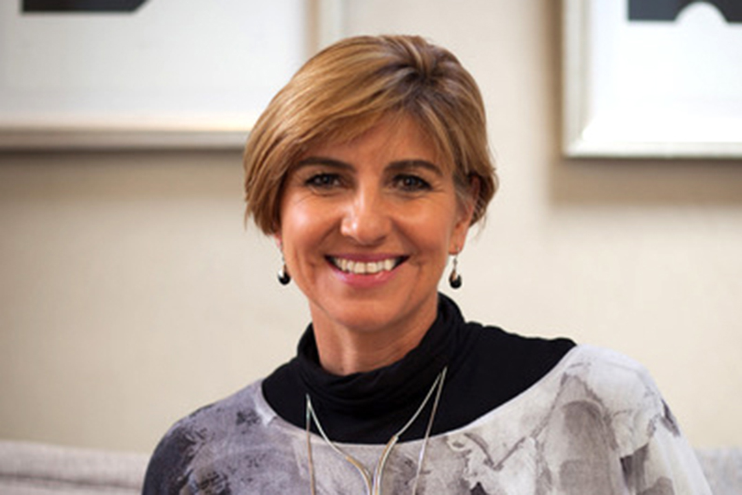 Picture of a women smiling into the camera 