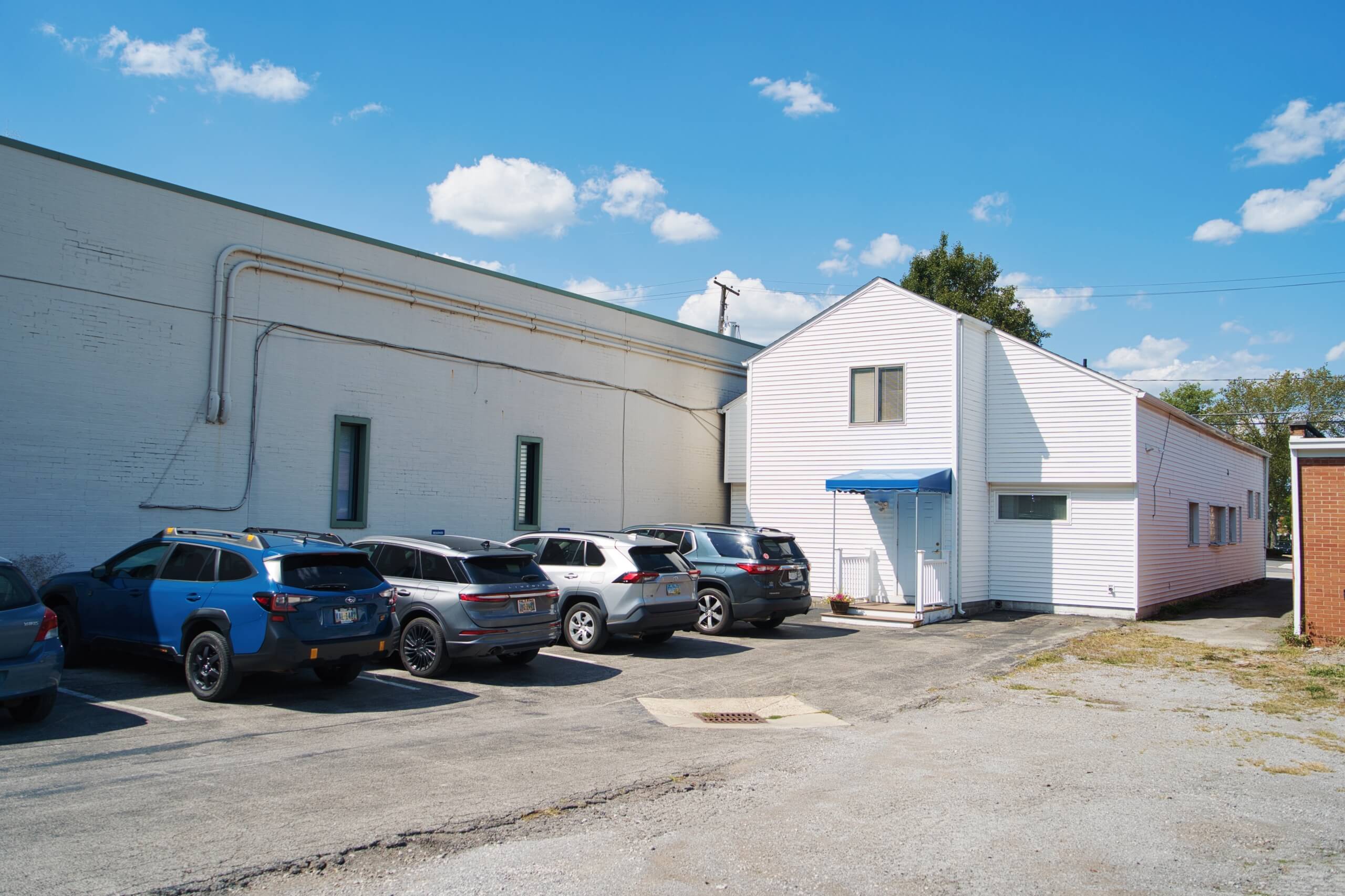 Parking is located behind the building or in front