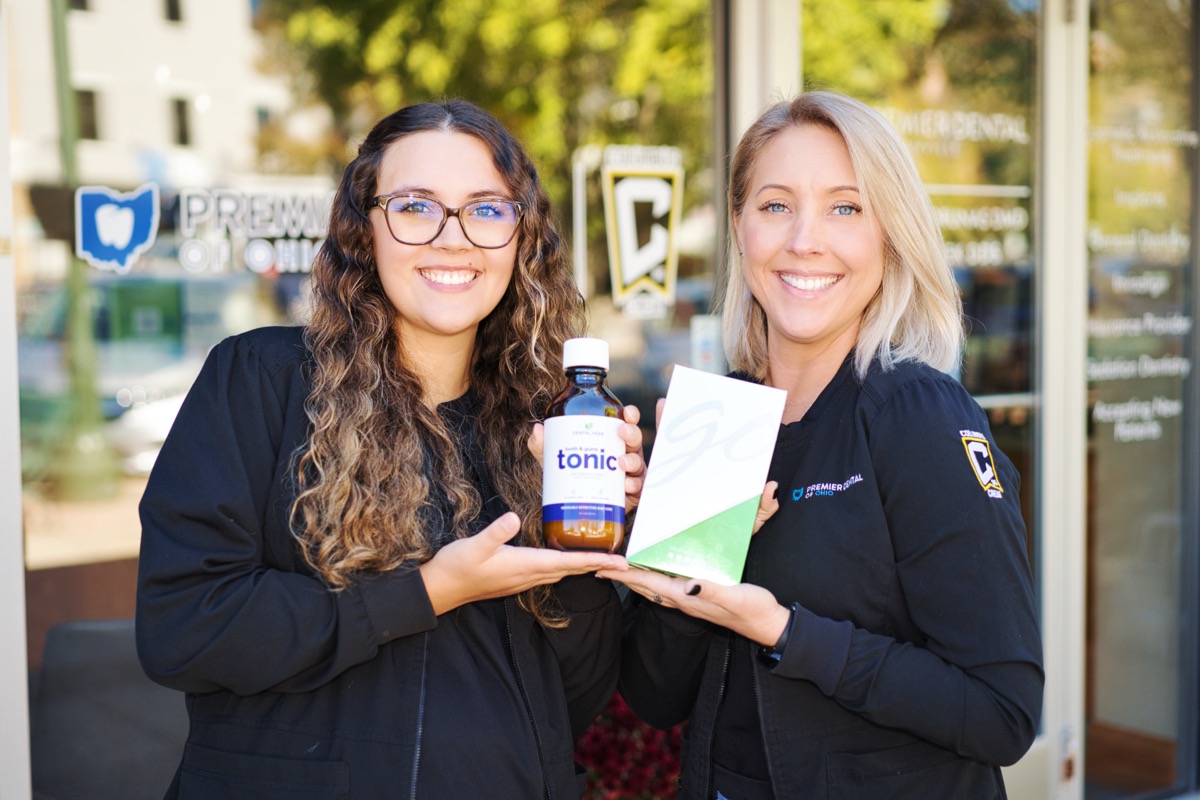 Premier Dental staff with recommended teeth whitening and mouth rinse products.