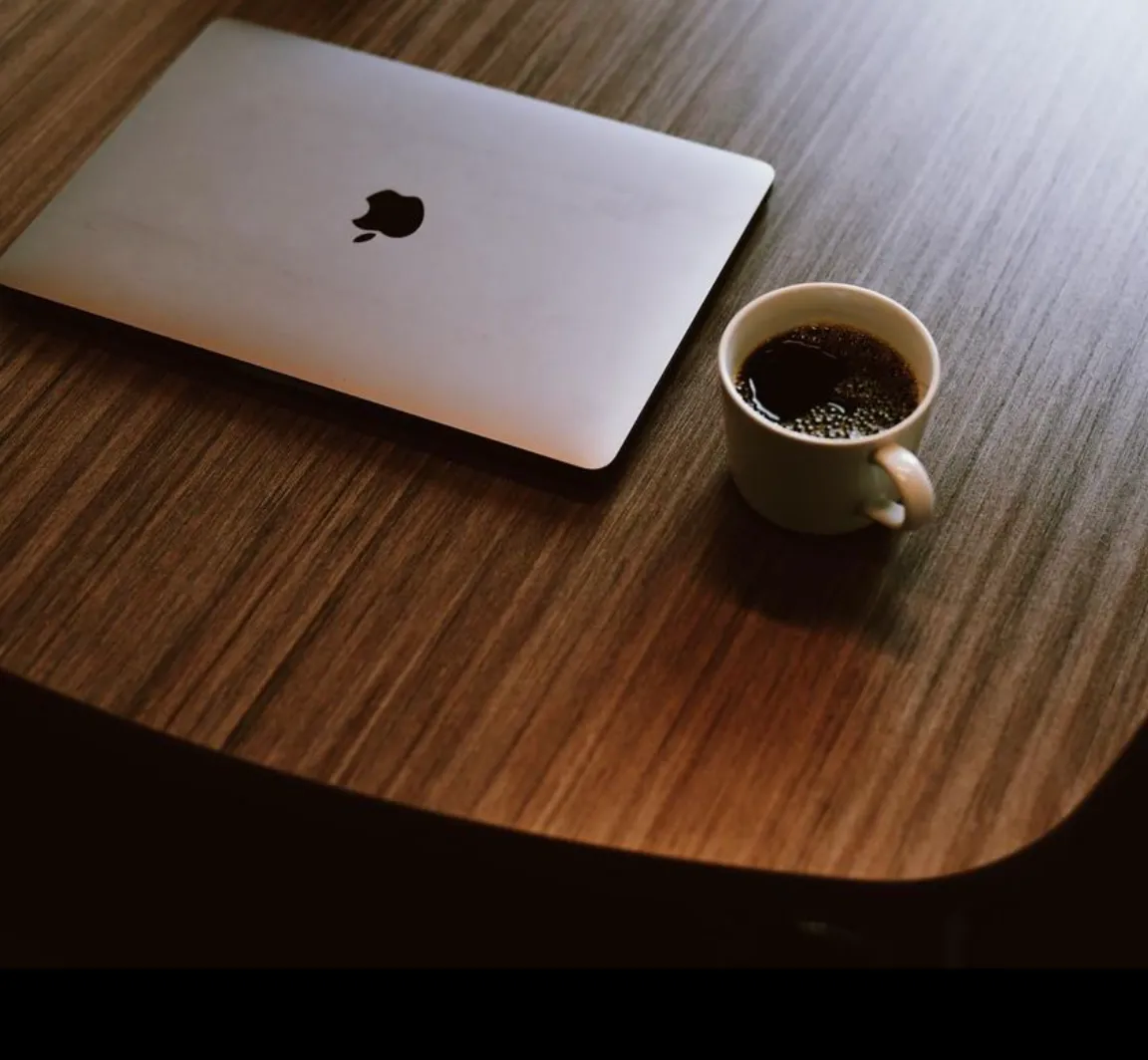 macbook and coffee cup
