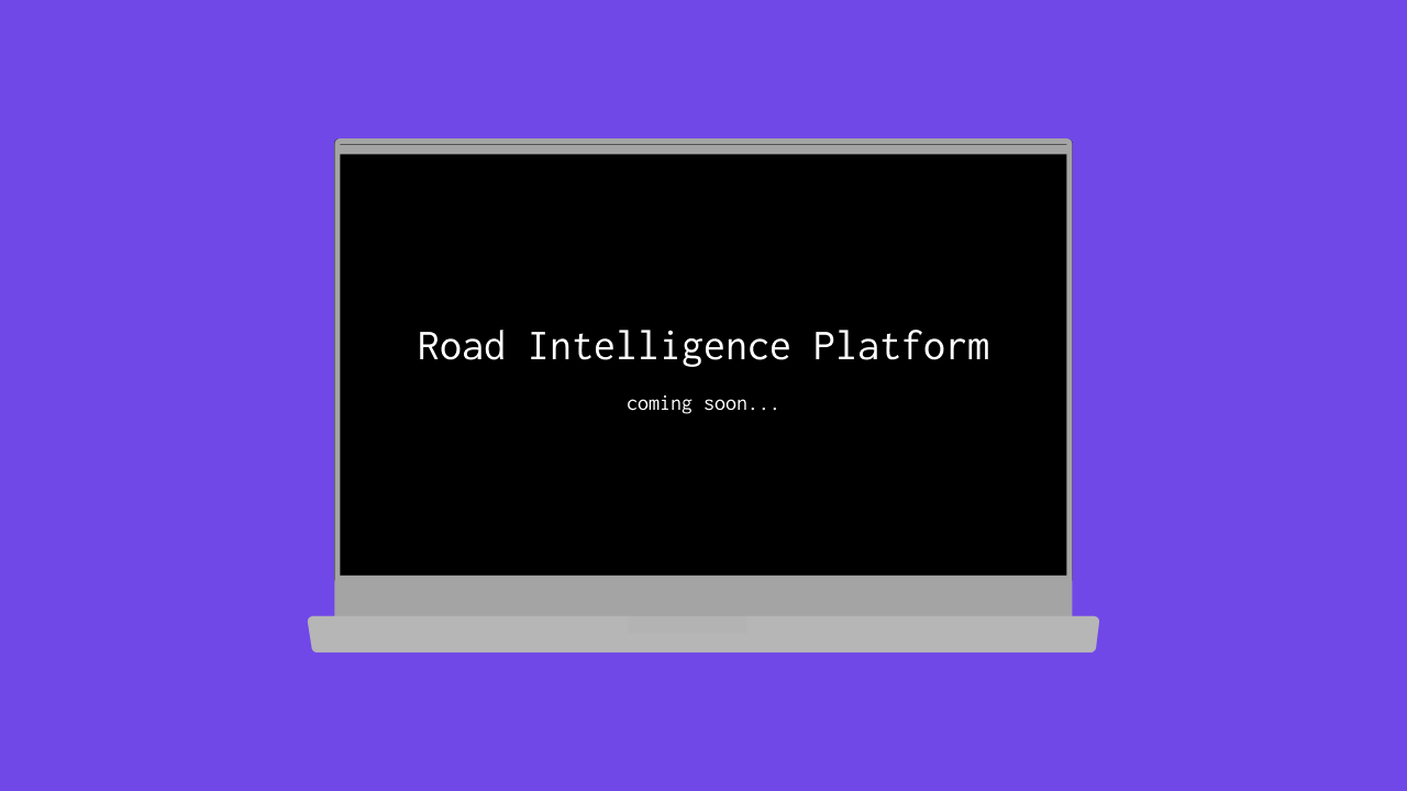 Laptop screen reading 'Road Intelligence Platform coming soon'