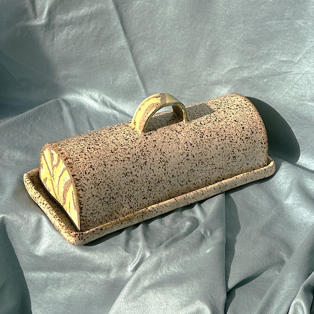 photo of a hand crafted spackled butterdish