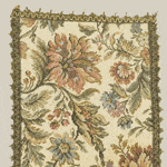 Vintage floral tapestry with intricate embroidered leaves and decorative border