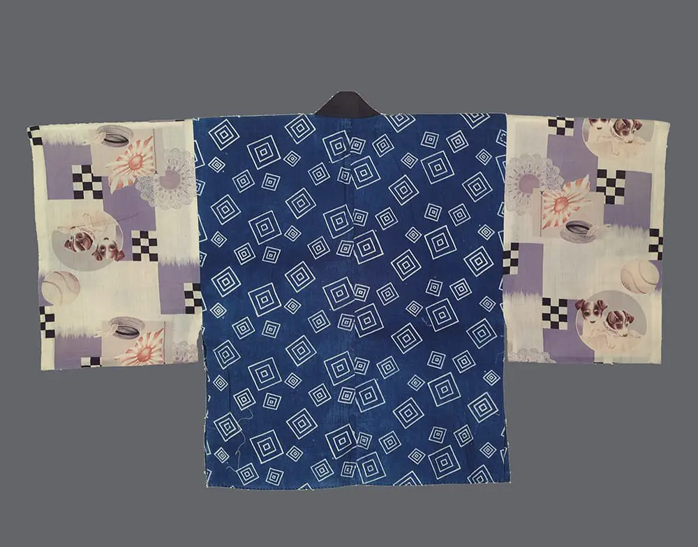 Indigo cotton han-juban with white geometric stenciling and wool sleeves featuring puppies and baseball patterns.