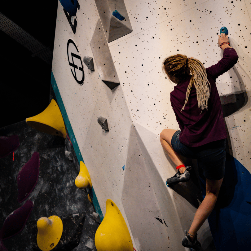 A climber climbing at the Font