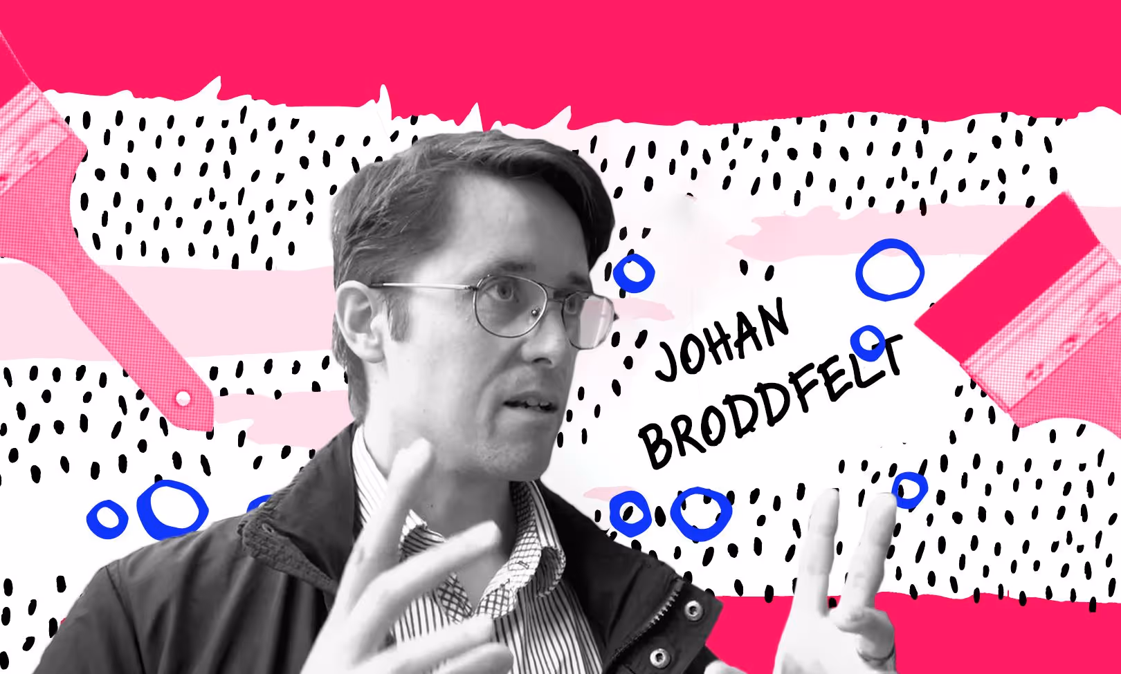 A man with glasses is making a speech