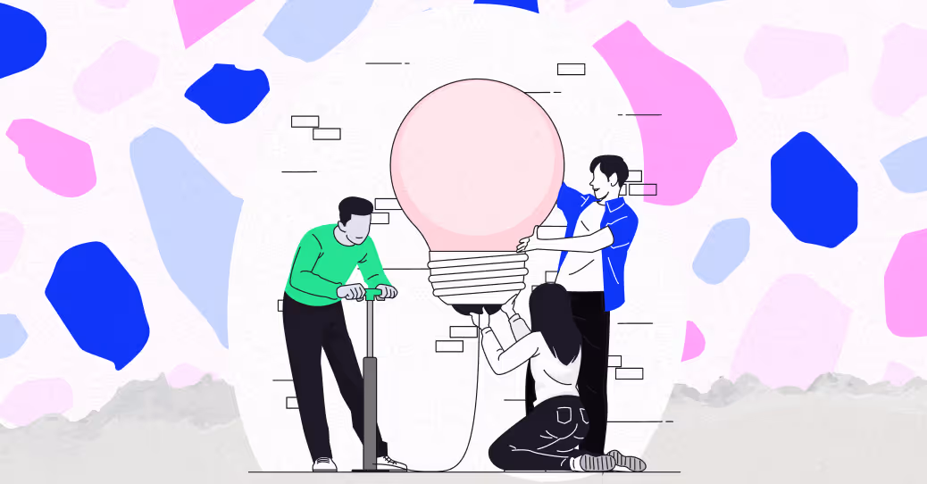 A group of people standing around a giant light bulb