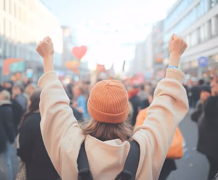 photo of people at a public happy demonstration in Berlin