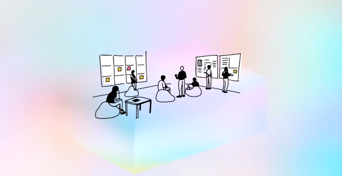 A group of people standing in front of a whiteboard