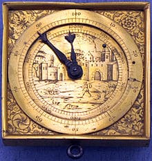 A clock that is on a wall with a blue background