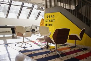 A room with chairs and a sign that says ideas start here