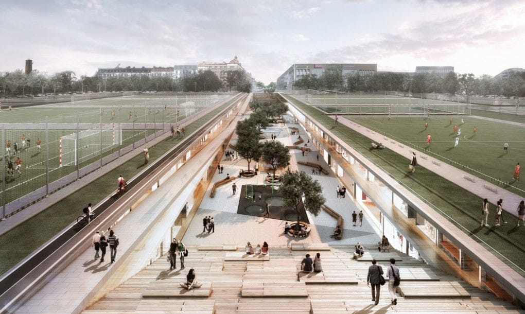 A group of people walking around a park 