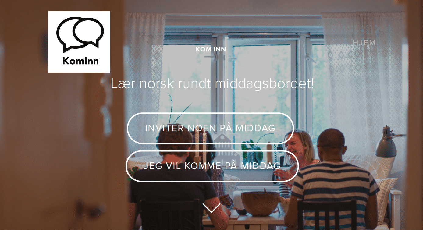 A group of people sitting at a table in front of a window