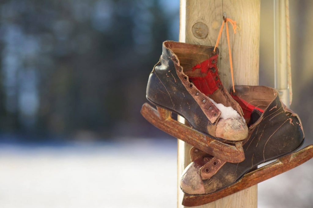 An old pair of shoes hanging on a pole