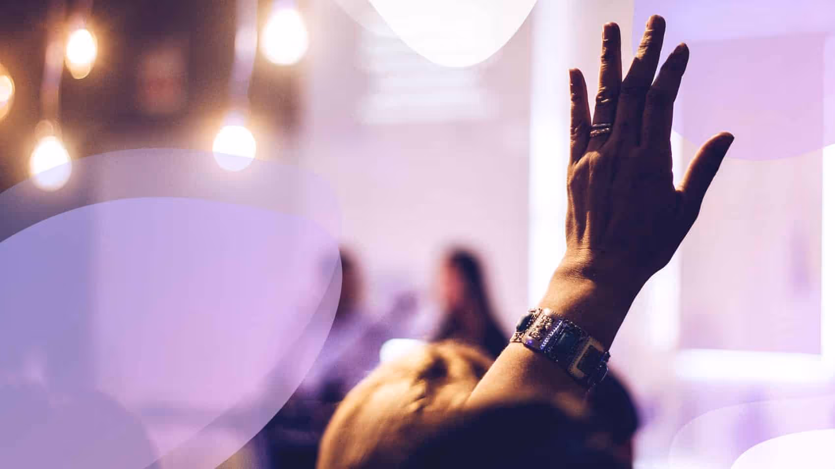 A person raising their hands in the air