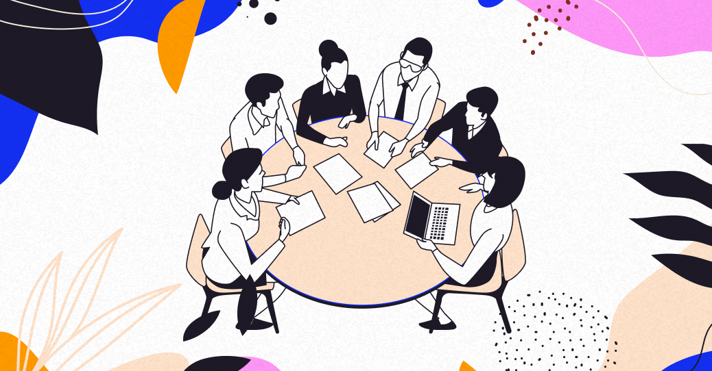 Un groupe de personnes assis autour d'une table