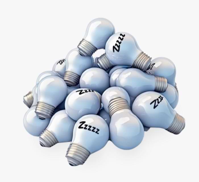 A pile of light bulbs, some with "Zzzzz" written on them, signifying sleep or inactive ideas.