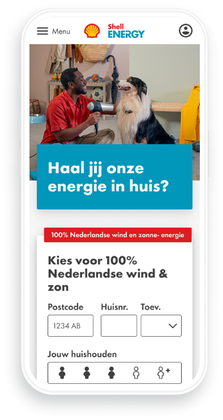 Mobile screen showing Shell Energy website with a man in a red shirt using a hairdryer on a large black and white dog, and an energy sign-up form in Dutch offering 100% Dutch wind and solar energy.