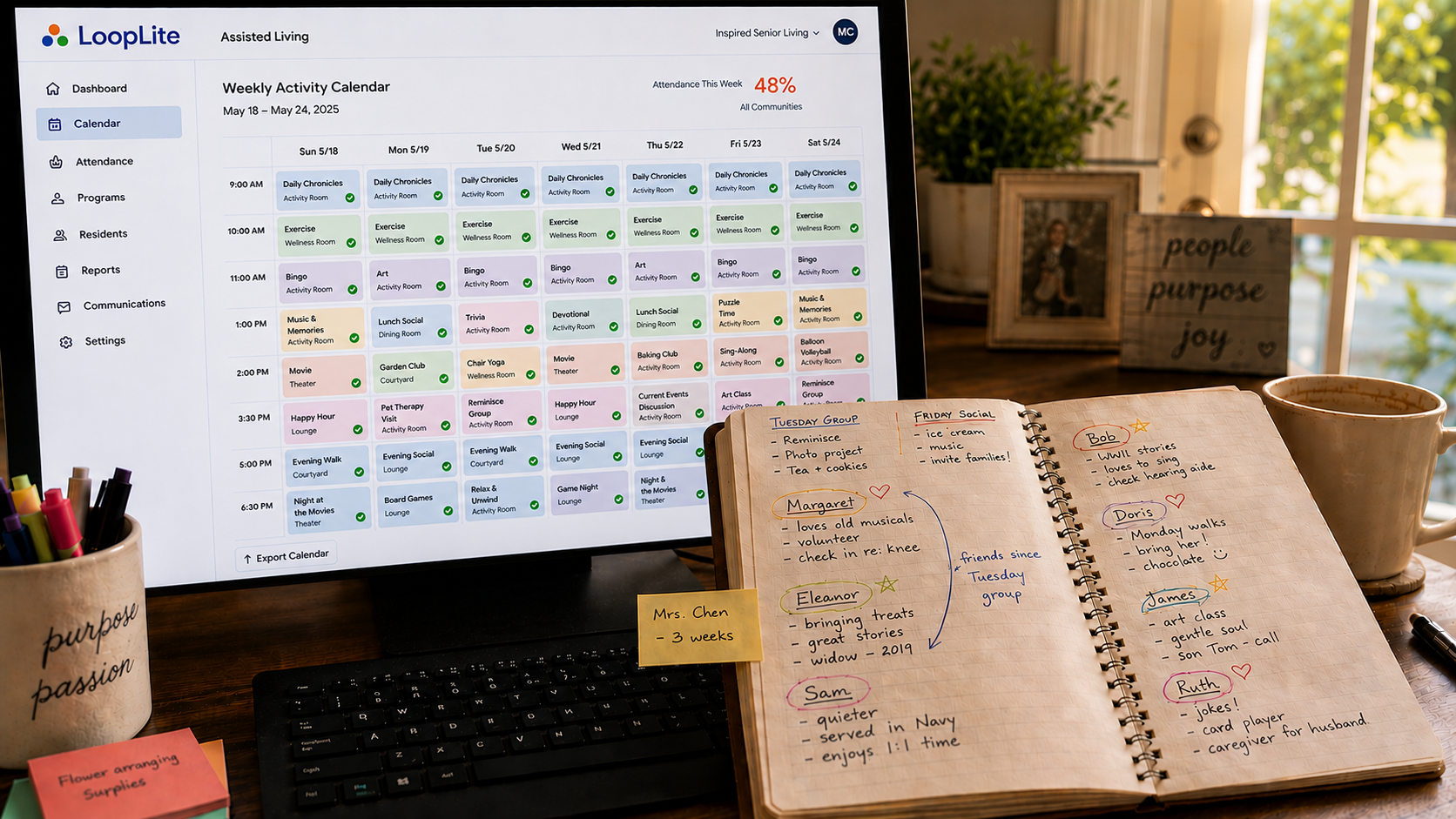 A life enrichment professional's desk showing a clean activity calendar on her computer screen next to a handwritten notebook filled with resident names, personal notes, and connection details the software never captured.