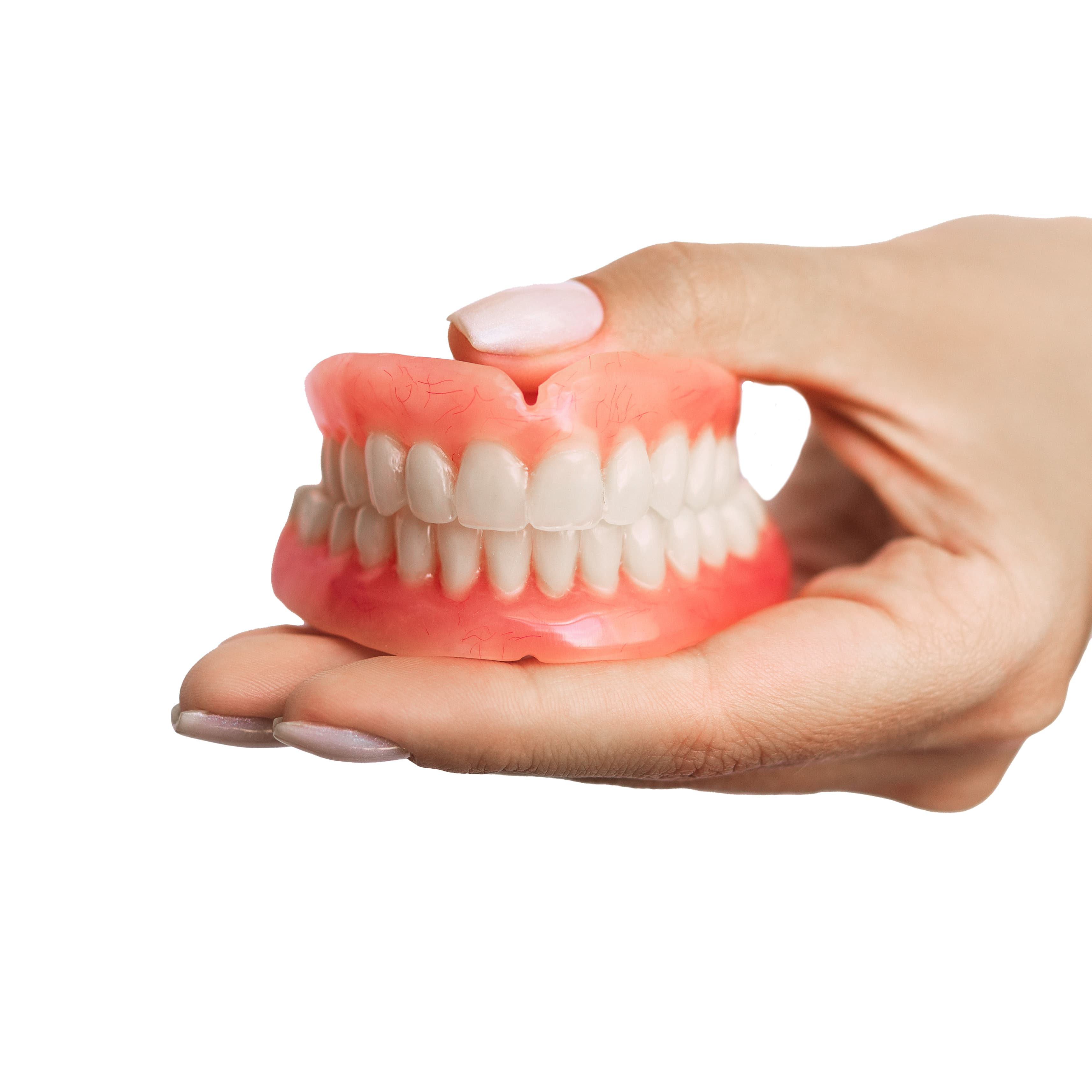 dentures in hand