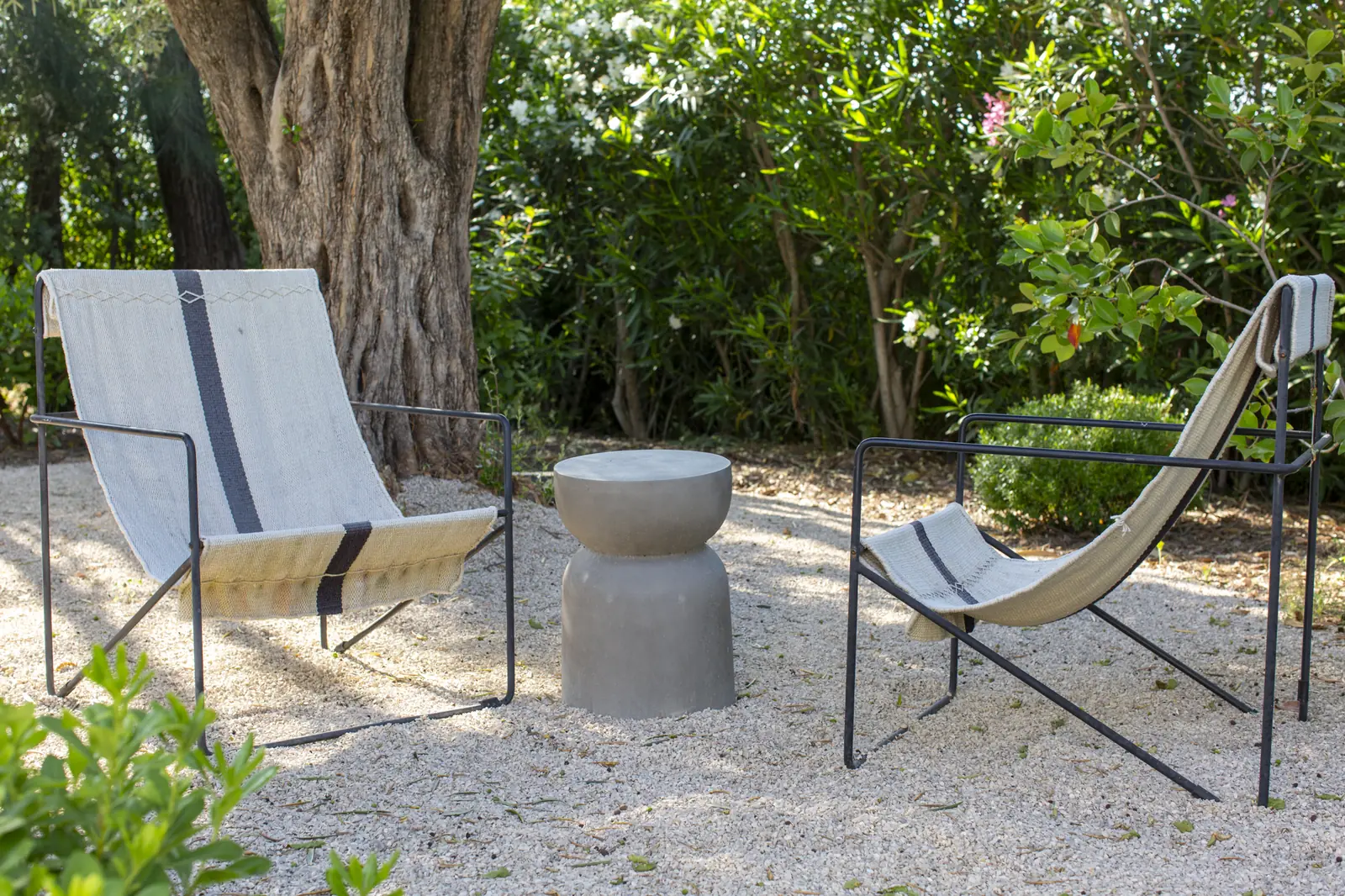 Garden chairs at Âmago, a family-run guesthouse near Faro in the Algarve