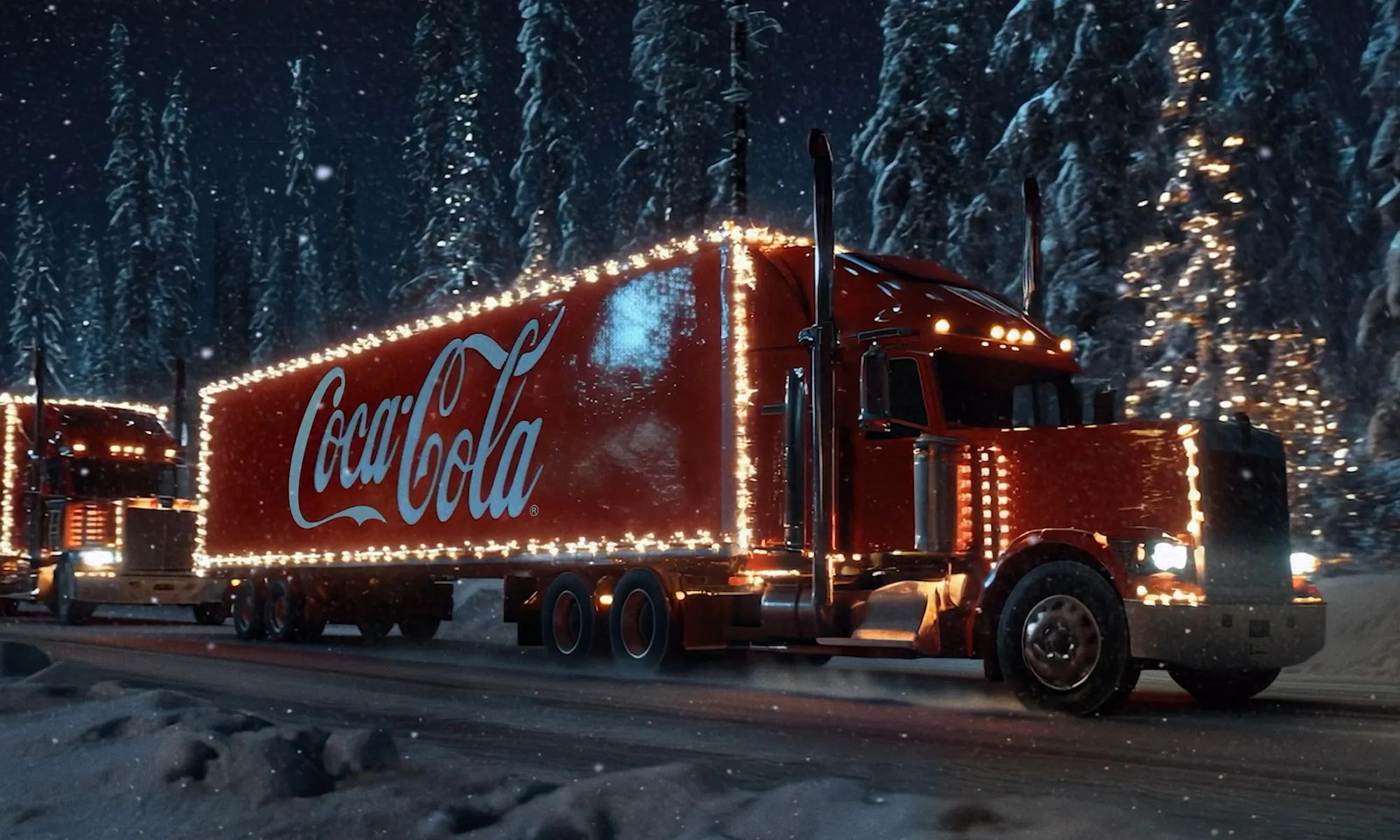 Red Coca-Cola truck decorated with Christmas lights driving through a snowy forest at night.