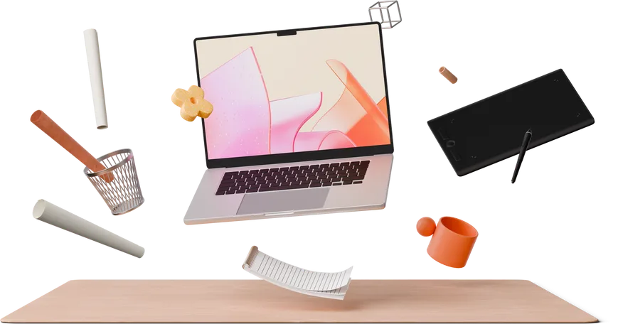 front view of designer's desk with laptop, tablet and notebook