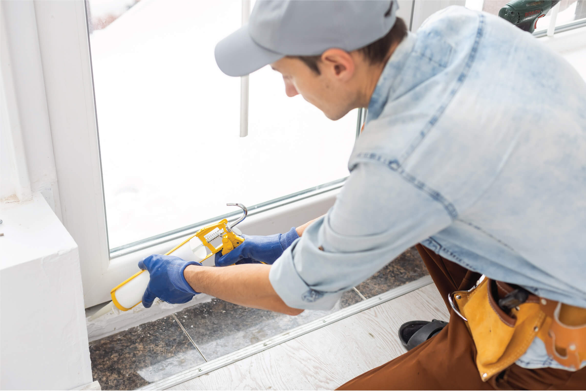 applying sealant to a window frame