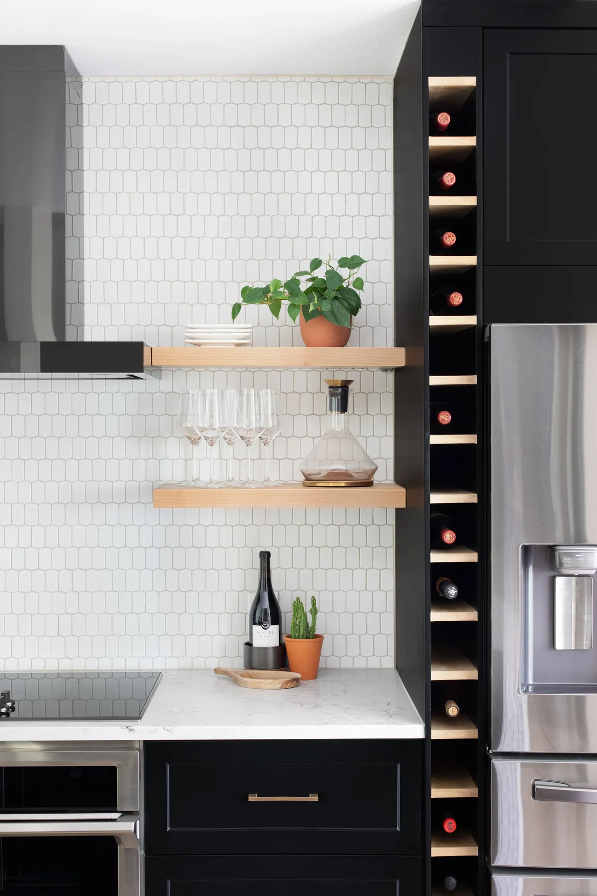 Dark Cabinets, Built-In Wine Rack, Floating Shelves, and Textured Backsplash