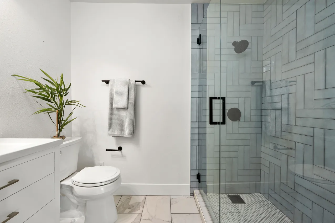 Bathroom Design | Glass Shower, White Vanity & Black Fixtures