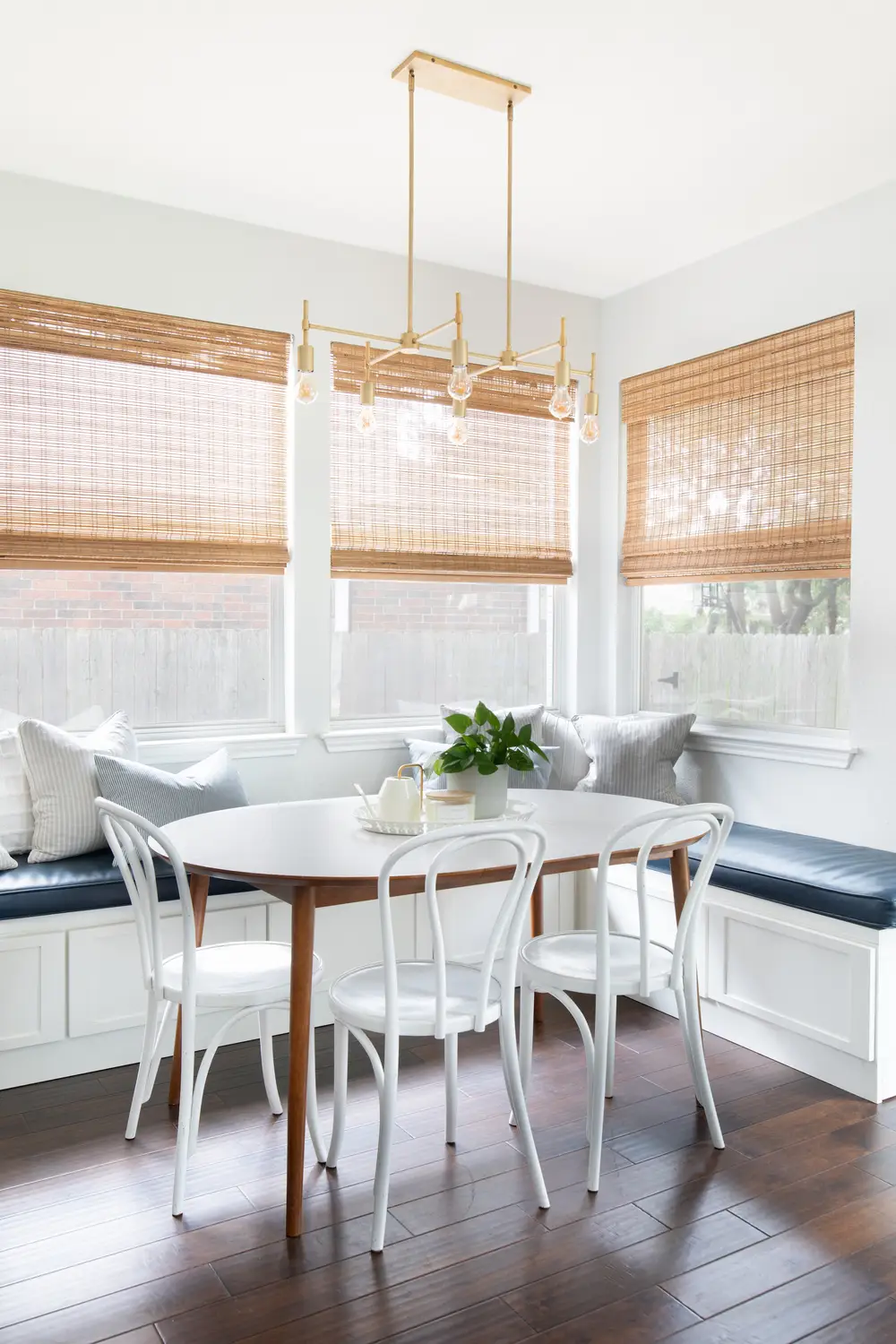 Bright Breakfast Nook with Blue Banquette and White Dining Set