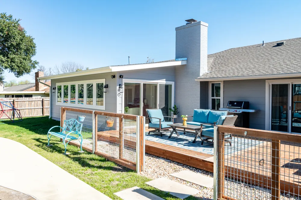 Backyard Featuring a Newly Added Sunroom