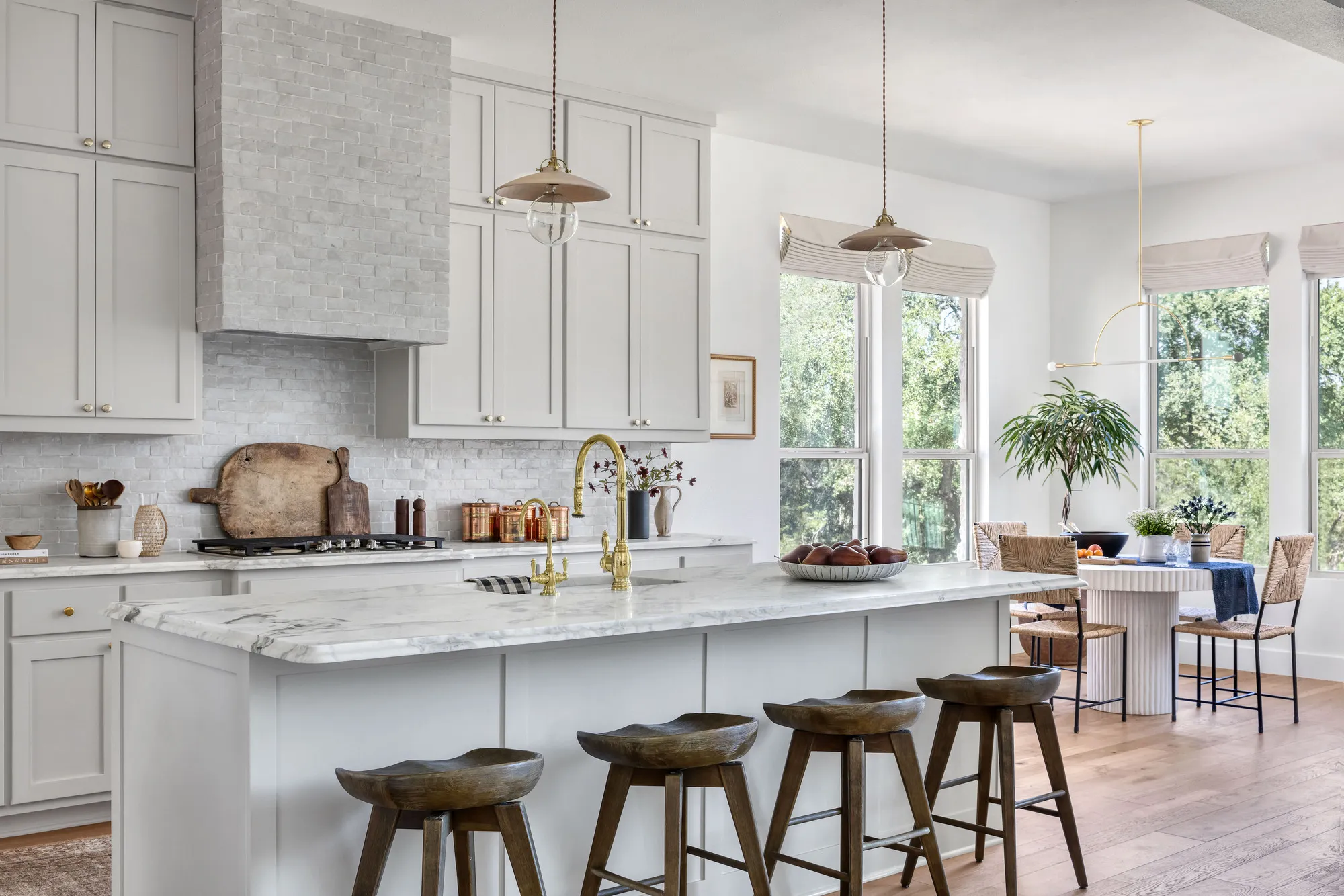 Bright, Spacious Kitchen With Large Marble Island and Bar Seating