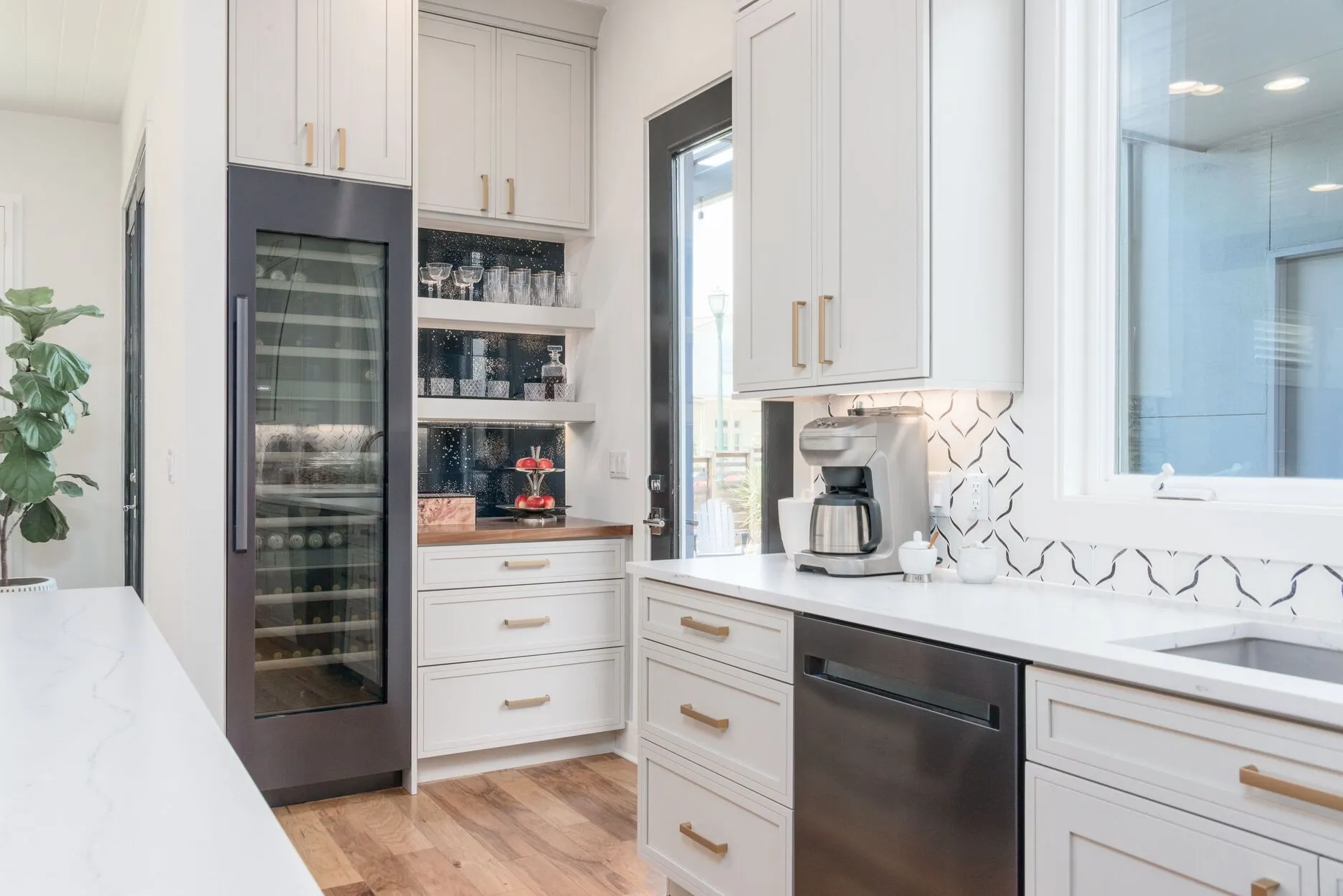 Modern Kitchen With Built-In Wine Cooler and Beverage Station