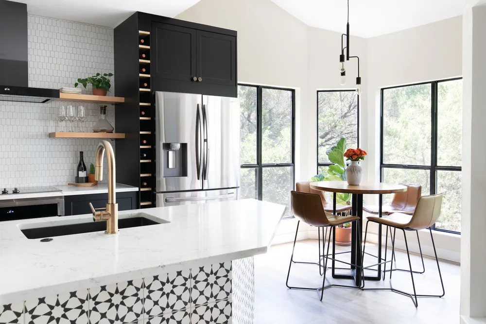 Kitchen Island With White Countertop and Geometric Tile Pattern