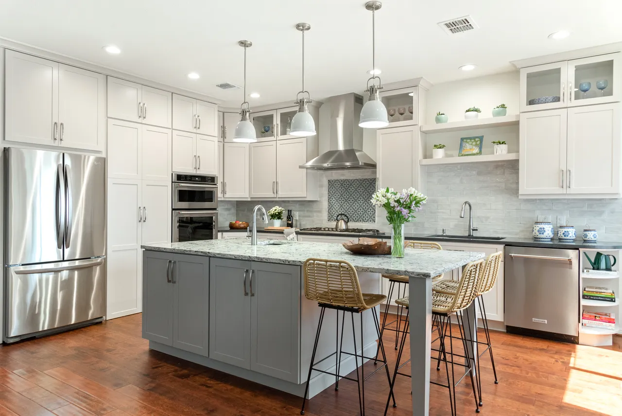 Light Cabinets, Stainless Appliances, and Large Island With Seating