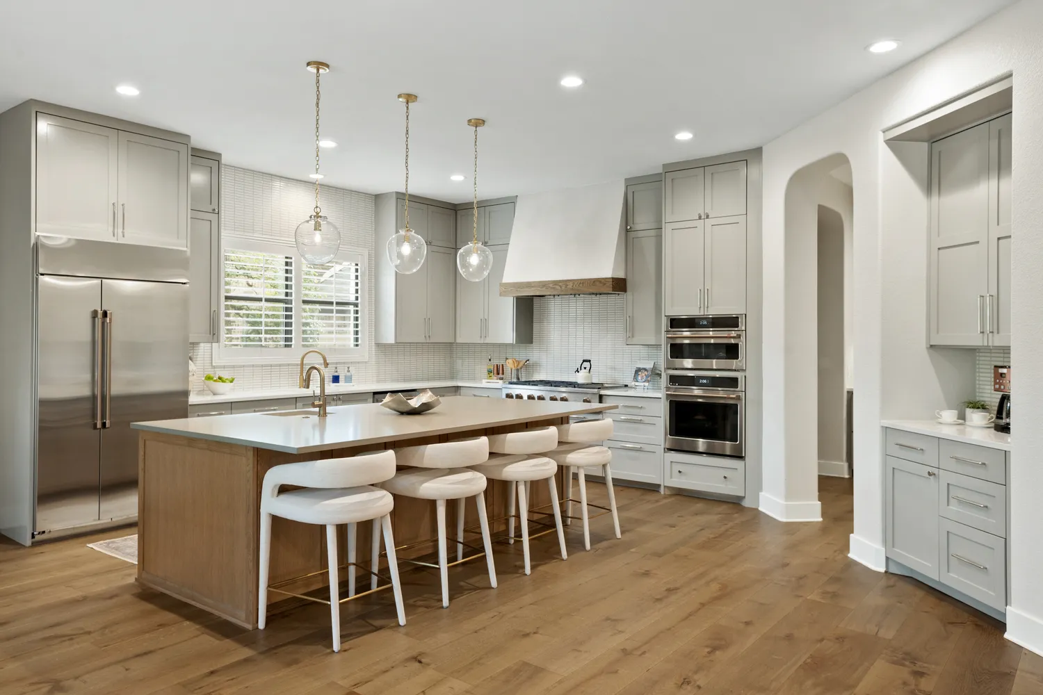 Spacious Modern Kitchen with Island Seating and Pendant Lighting