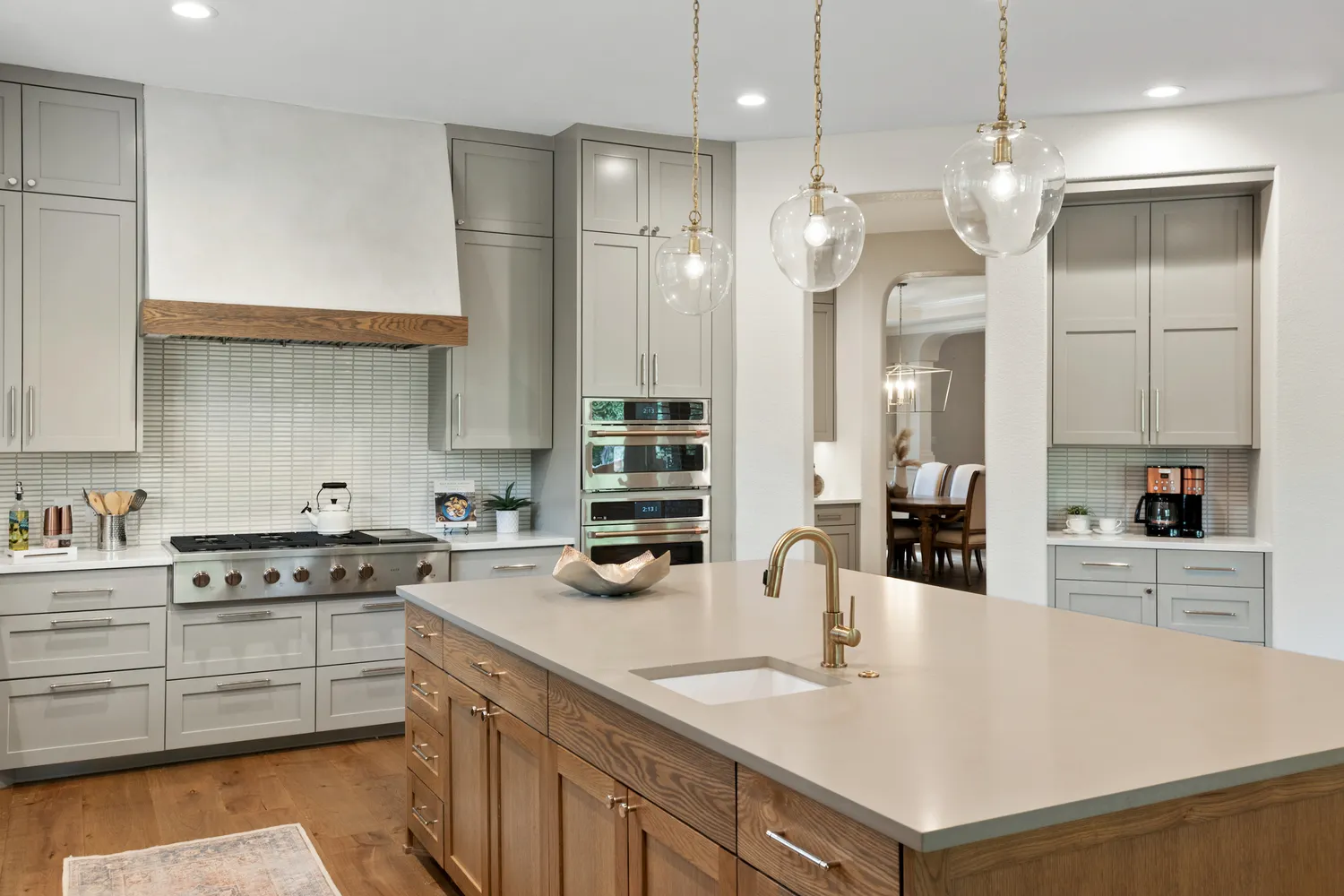 Kitchen With Recessed-Panel Cabinets and Marble Finishes